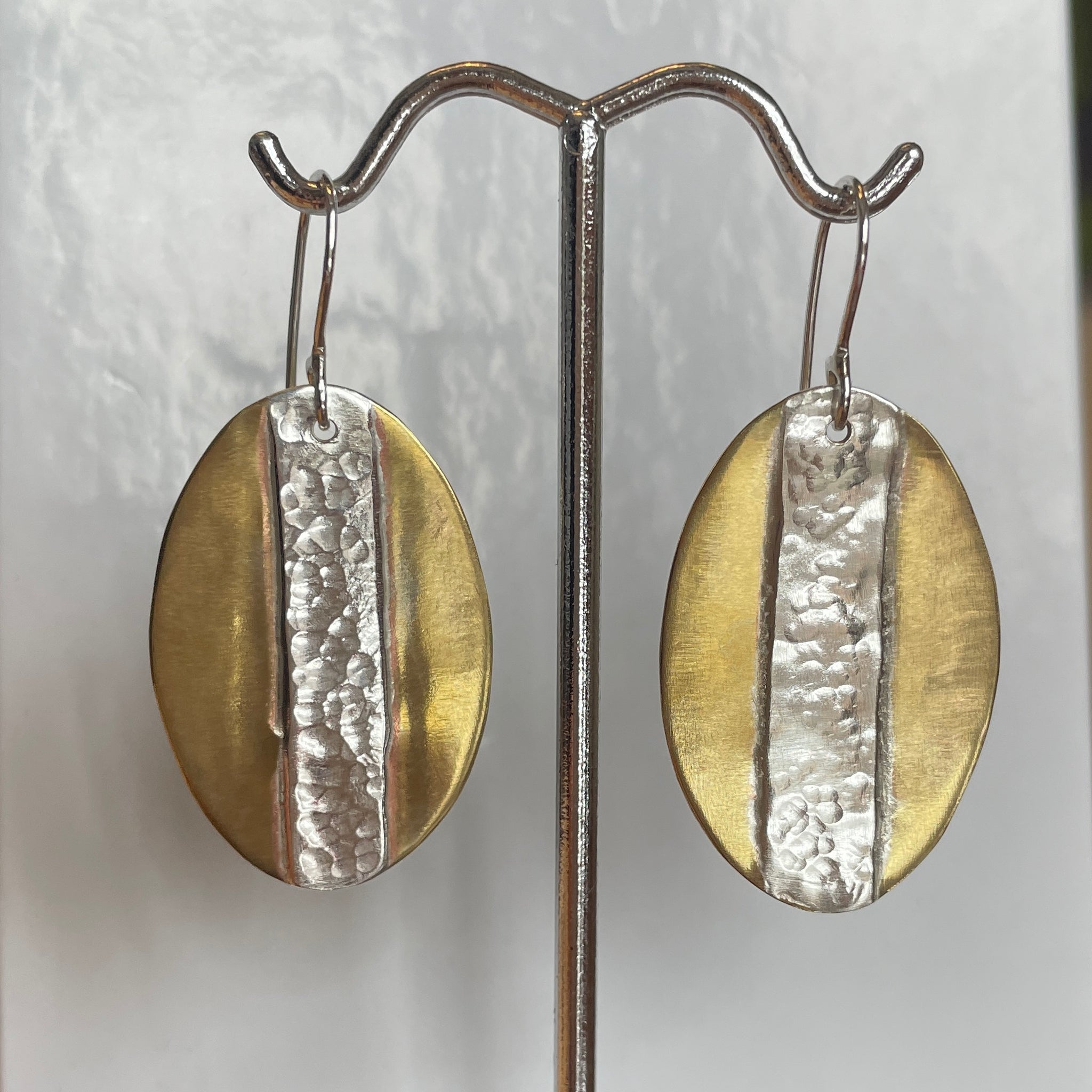 Brass oval with silver appliqué earrings
