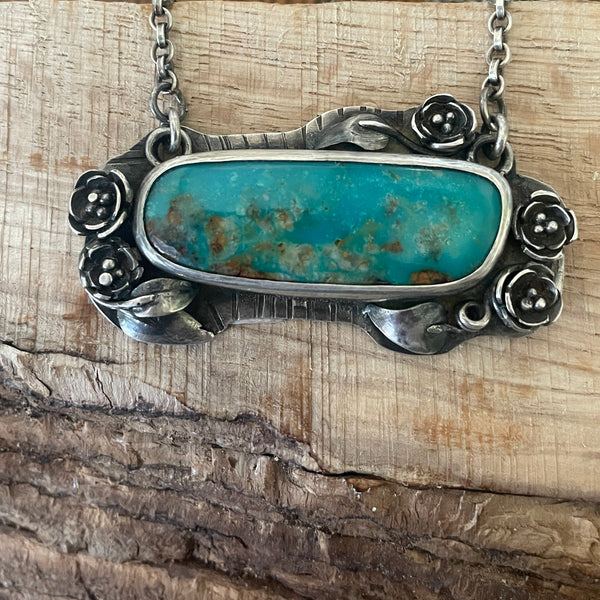 TURQUOISE PENDANT WITH SILVER FLOWERS
