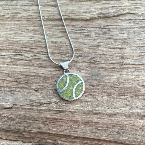 Sterling silver snake chain with crushed inlaid yellow stone peace pendant.  About size of a quarter.