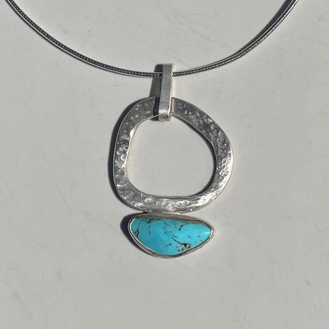 Wonky oval silver pendant with turquoise
